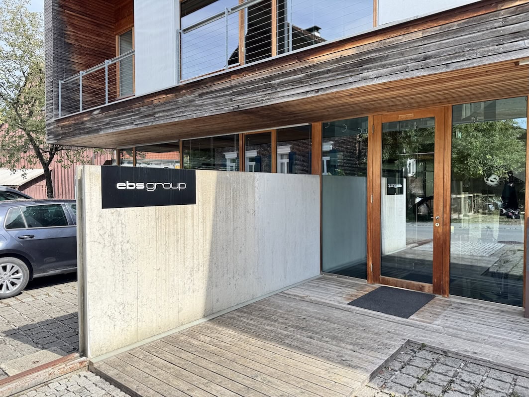 Entrance to the EBS Group office with a wooden facade